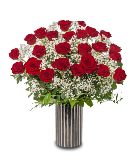 Passion Roses with Red Freedom Roses and baby’s breath in a black ceramic vase with silver accents, showcasing elegance and freshness from Walter Knoll Florist.