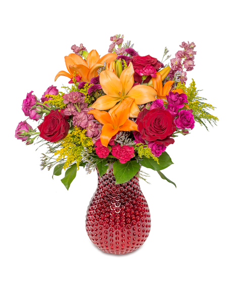 Image of a taller red vase filled with vivid sunset colors of beauty