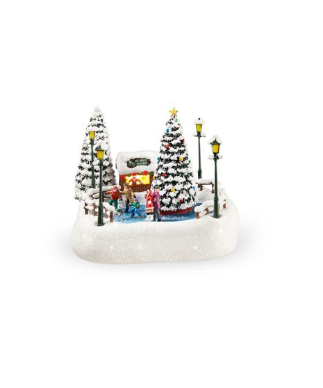 Thomas Kinkade 2024 Christmas collectible Oh What Fun featuring ice skaters, a Dalmatian, snow-covered trees, and a lit rental shack crafted by Walter Knoll Florist