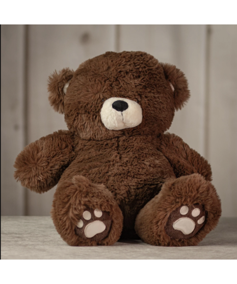 Four plush teddy bears in soft brown, grey, ivory, and light beige sitting on a surface, showcasing different colors of the cuddly Snuggle Bear Collection.