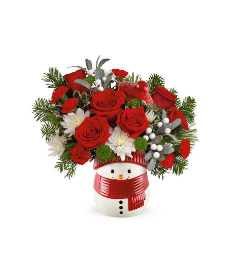 Snowman jar filled with fresh red and white flowers, winter greens, and festive accents, crafted by Walter Knoll Florist