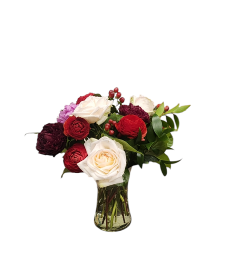 A luxurious bouquet of fragrant peonies, garden roses, and ranunculus in shades of pink, red, and blush, arranged beautifully for a romantic and elegant display.