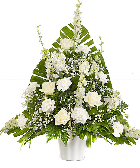 about elegant white wreath on ruscus wrapped easel from Walter Knoll  Florist, St Louis, MO