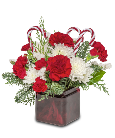 Candy Cane Lane' Floral Arrangement: Red and white flowers with acrylic candy canes - a festive holiday scene.