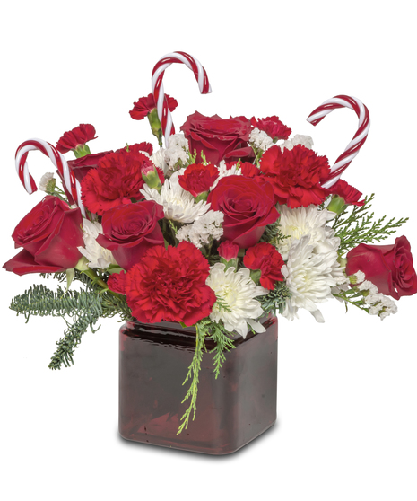 Candy Cane Lane' Floral Arrangement: Red and white flowers with acrylic candy canes - a festive holiday scene.