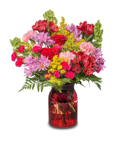 Be Mine arrangement with lavender daisies, pink carnations, red alstroemeria, red roses, Bells of Ireland, and yellow solidago. Romantic and vibrant for Valentine’s Day.