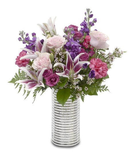 Boogie Nights Floral Arrangement: pink & purple flowers in a silver vase, featuring roses, lilies, stock, carnations.