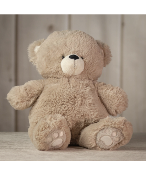 Four plush teddy bears in soft brown, grey, ivory, and light beige sitting on a surface, showcasing different colors of the cuddly Snuggle Bear Collection.