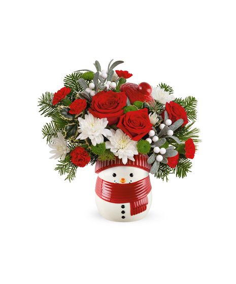 Snowman jar filled with fresh red and white flowers, winter greens, and festive accents, crafted by Walter Knoll Florist