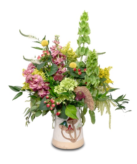 Ceramic mushroom vase with mauve, green, yellow, red, and white flowers in a vegetative style, featuring a dried mushroom sponge accent.