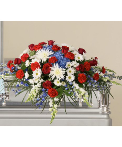 red, white, and blue patriotic casket spray