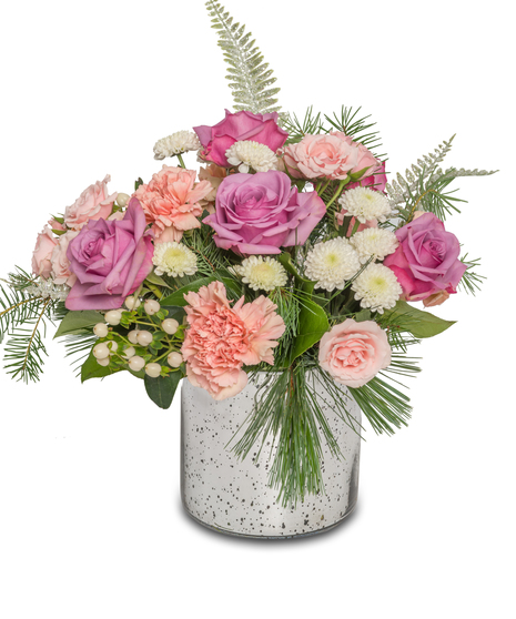 Winter floral arrangement in a silver vase with lavender roses, pink mini roses, white hypericum berries, button chrysanthemums, and frosted ferns