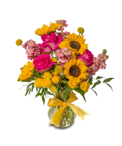 Shine For You floral arrangement with sunflowers, pink roses, spray roses, stock, billy balls in a glass vase with a yellow bow. 