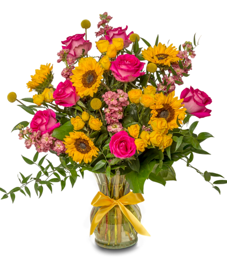 Shine For You floral arrangement with sunflowers, pink roses, spray roses, stock, billy balls in a glass vase with a yellow bow. 