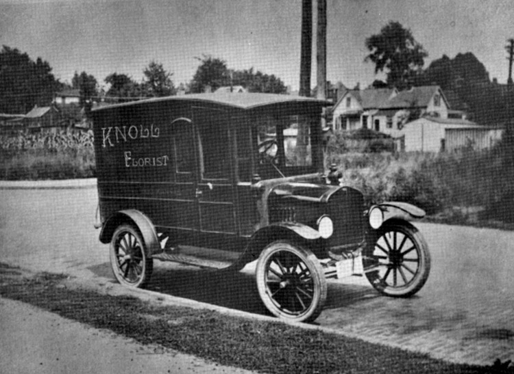 One of Knoll Florists' first delivery vehicle, a painted truck, near the turn of the century