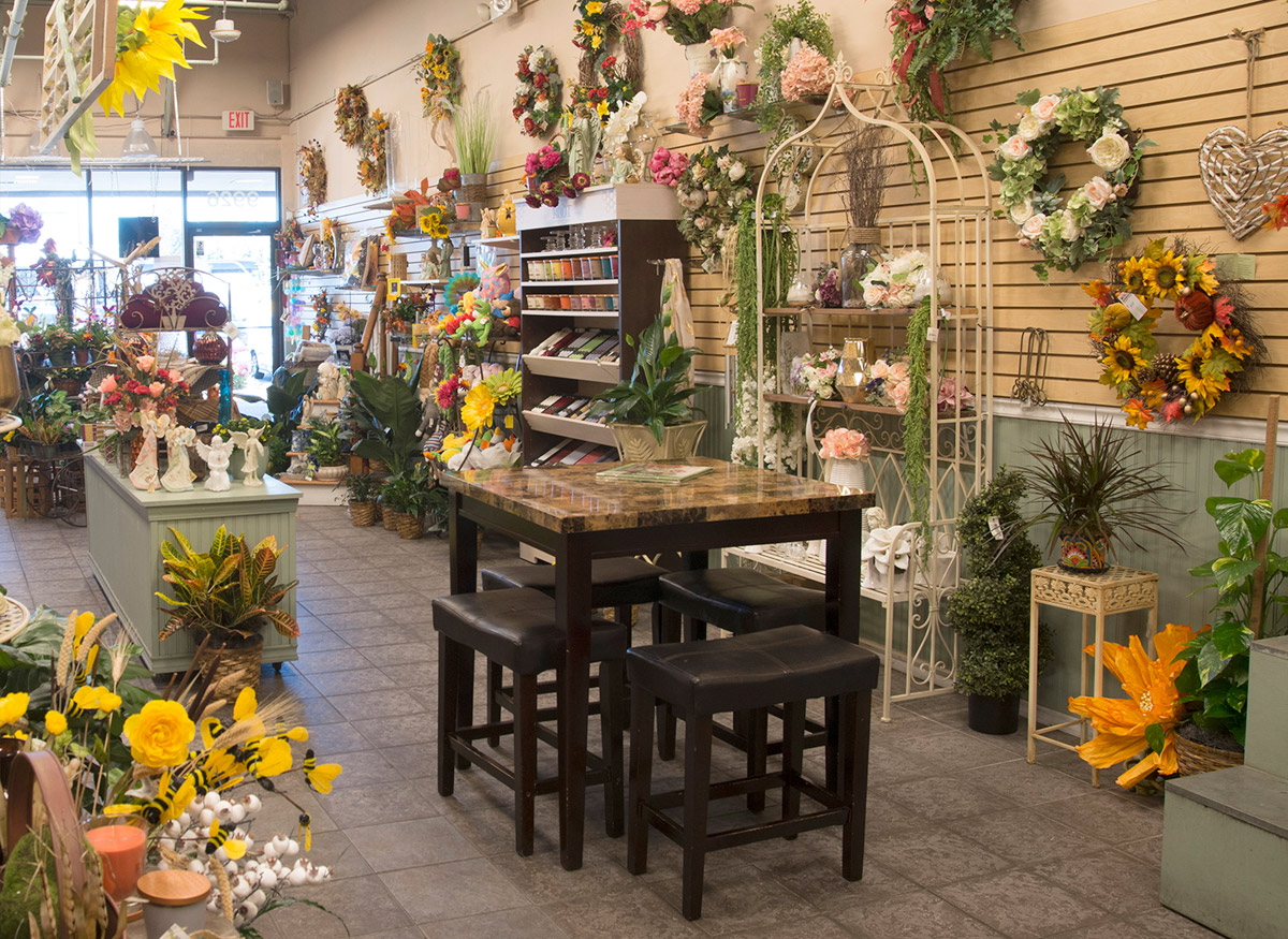 A wide range of colorful floral arrangements, awaiting their new home